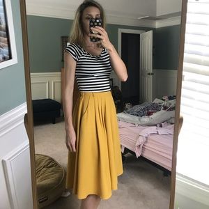 High waisted pleated midi skirt.